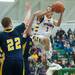 Ypsilanti's Justin Bernard jumps to make a basket against the South Lyon's during the second half of the Class A regional finales at Huron High School Wednesday, Mar.13th.
Courtney Sacco I AnnArbor.com 