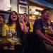University of Michigan junior Priya Dungarani and senior Rahil Dharia cheer for the Wolverines as they watch them defeat Syracuse in the Final Four game at the Arena Sports Bar and Grill in downtown Ann Arbor on Saturday night. Courtney Sacco I AnnArbor.com