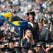 A graduate waves a Michigan flag before the start of the University of Michigan's spring commencement at Michigan stadium, Saturday May 4.
Courtney Sacco I AnnArbor.com    