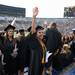 A graduate waves before the start of the University of Michigan's spring commencement at Michigan stadium, Saturday May 4.
Courtney Sacco I AnnArbor.com    