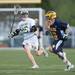 Saline's Brett Braun runs the ball up the field during their game against Huron Wednesday, May 8.
Courtney Sacco I AnnArbor.com  