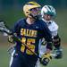 Saline's Daniel Kosek runs the ball up the field during their game against Huron Wednesday, May 8.
Courtney Sacco I AnnArbor.com  