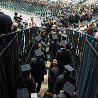 A graduate looks up at the audience as the 2013 class enters Convocation Center Saturday, May 18.Courtney Sacco I AnnArbor.com