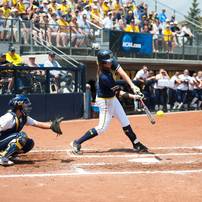 Wolverines pitcher sophomore Sara Driesenga hits the ball during the second inning of the NCAA regional title game against California, Sunday May 19.Courtney Sacco I AnnArbor.com   