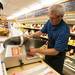 Tommy York uses the deli slicer at Morgan and York in Ann Arbor.
Courtney Sacco I AnnArbor.com

