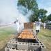 Volunteers cook around 12,000 half chickens over charcoal pits at Alumni Memorial Field for the 60th Manchester Chicken Broil.  
Courtney Sacco I AnnArbor.com 