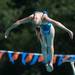 Sabrina L.  jumps off the board during the 15 and over diving portion of the WISC championships, at the Huron Valley Swim Club in Ann Arbor, Wednesday, July 24.
Courtney Sacco I AnnArbor.com     