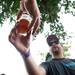Tyler Glaze from Short's Brew hands off a sample of beer during the Michigan Summer Beer Festival at Riverside Park in Ypsilanti, Saturday, July 27.
Courtney Sacco I AnnArbor.com