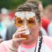 Aubrie Martinez of Troy, Mich. drinks a sample of beer during the Michigan Summer Beer Festival at Riverside Park in Ypsilanti, Saturday, July 27.
Courtney Sacco I AnnArbor.com