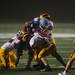 Skylines quarterback Askaree Crawford is tackled by the Harland defense during the froth quarter of their game, Thursday, Aug. 29.
Courtney Sacco I AnnArbor.com    