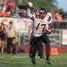 Belleville's quarterback Luke Edwards points as he looks for an open teammate during the first quarter of their game against Lincoln at Lincoln High School, Friday, Aug, 30.
Courtney Sacco I AnnArbor.com    