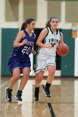 The Irish's Rachel DeMarco drives the ball down court against Pioneer's Jennifer Fichera duringThursday evenings game at Father Gabriel Richard High School.
Courtney Sacco I AnnArbor.com