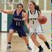 The Irish's Jessica Jenkins drives the ball down court against Pioneer's Elizabeth Fichera during Thursday evenings game at Father Gabriel Richard High School.
Courtney Sacco I AnnArbor.com 