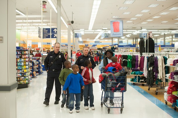 Pittsfield firefighters Craig Liggett and Dan Olson walk through Meijer with the Zirker boys during this years shop with a hero event.
Courtney Sacco I AnnArbor.com