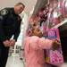 A three year old Lily Smith picks out a toy for her self with the help of Milan police Sargent Knieper during this years shop with a hero event at Meijer.
Courtney Sacco I AnnArbor.com 