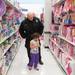 Northfield Officer Eberhart helps try to pick put a toy during this years shop with a hero event at Meijer.
Courtney Sacco I AnnArbor.com 