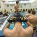 A Saline swimmer puts on his swim cap before the start of their meet against Pioneer, Jan. 10.
Courtney Sacco I AnnArbor.com   