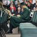 An undergraduate student plays with his cell phone during EMU's  2012 winter commencement.
Courtney Sacco I AnnArbor.com  