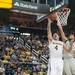 Wolverines freshman Mitch McGary tries to make a basket against EMU's Austin Harper during Thursday nights game.
Courtney Sacco I AnnArbor.com 
 