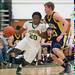 Huron's Demetrius Sims drives the ball down court during Friday nights game against Chelsea.
Courtney Sacco I AnnArbor.com 