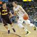 The Wolverines freshman Nik Stauskas drives the ball against Central Michigan's Spencer Krannitz during their game Saturday Dec. 29. 
Courtney Sacco I AnnArbor.com    