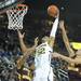 Michigan Junior Jordan Morgan jumps to make a rebound against Central Michigan during Saturday Dec. 29 game.Courtney Sacco I AnnArbor.com 