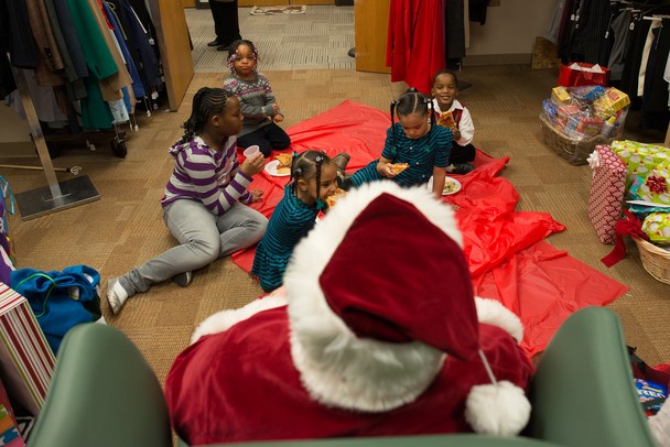 Kids ate pizza and cookies with Santa before he handed out toys Saturday afternoon at Dress For Success Michigan in Ypsilanti.
Courtney Sacco I AnnArbor.com