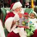 Santa shows 4-month-old Eric his new toy.
Courtney Sacco I AnnArbor.com  