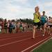 A group of runners on their first lap of the Saline High School track as they try to beat the recored for the fastest mile run in Michigan, Sunday, August, 4.
Courtney Sacco I AnnArbor.com 