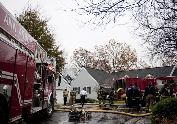 Firefighers resound to the scene on Heritage Drive in Ann Arbor on Tuesday. Fire Chief Chuck Hubbard says they extinguished the fire in 30 minutes, but the interior of the structure is completely burnt. He was unable to determine the cause of that fire at the time. Daniel Brenner I AnnArbor.com