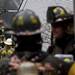 Firefighters use a hose to extinguish flames from a structure in Ann Arbor  on Tuesday. Daniel Brenner I AnnArbor.com