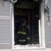 A firefighter walks through the destroyed structure after a fire on Tuesday. Daniel Brenner I AnnArbor.com