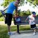 Ann Arbor resident Drew Harrigan, 3, stretches with his mom, Steph, before the mile run at Gallup Park on Sunday, July 14. Daniel Brenner I AnnArbor.com