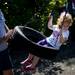 Ypsilanti resident Mark Jacobsen pushes his granddaughter Katherine, 3, on a tire swing at Gallup Park on Sunday, July 14. Katherine's grandmother, Jenni, finished second in her age division. Daniel Brenner I AnnArbor.com