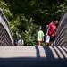 People walk over a bridge with fishing rods at Gallup Park on Sunday, July 14. Daniel Brenner I AnnArbor.com