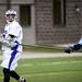 Pioneer senior Dylan Graham looks to pass while defended on Friday, April 12. AnnArbor.com I Daniel Brenner