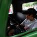 A young boy sits in the front seat of a 1937 Ford Pickup truck at the end of the Classic Car Show during the Chelsea Sounds and Sights on Friday, July 26. Daniel Brenner I AnnArbor.com