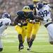 Michigan running back Fitzgerald Toussaint runs for extra yards in the game against Northwestern on Saturday. Daniel Brenner I AnnArbor.com