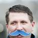 Ann Arbor resident and season ticket holder Kelly Cox wears a fake mustache for Movember men's health awareness month on Saturday. Daniel Brenner I AnnArbor.com