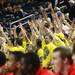 Michigan fans celebrate a three pointer made behind Ferris State's bench as Michigan took on Ferris State at the Crisler Arena Friday November 11, 2011. Michigan won the game 59-33. (AP Photo/AnnArbor.com, Jeff Sainlar I AnnArbor.com)