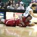 Rochester's Stephan Hennings (bottom) and Antoine Chandler battle for a loose ball as Eastern Michigan University took on Rochester College at the Convocation Center Wednesday November 23, 2011.EMU won the game 62-43. Jeff Sainlar I AnnArbor.com