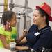 Shavaughn Thomas shares a moment with daughter Miyami, 7, as the Ann Arbor Fire Department hosted its annual Bikes for Tykes event Tuesday December 13, 2011. The AAFD and Two Wheel Tango, a local bike shop, team up to provide bikes and helmets for children ages 4 to 10 who need assistance during the holiday season. Jeff Sainlar I AnnArbor.com