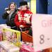 Maria Sandlin, left, is helped by Samantha Mansfield in exploring the aisles for gifts at the Salvation Army of Washtenaw County. Jeff Sainlar I AnnArbor.com