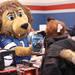 The Detroit Lions' mascot, Roary, promotes a football video game to a shopper as the Salvation Army of Washtenaw County will put toys under the tree for local families in need at its annual Christmas Toy Shop. Families who signed up for Christmas assistance picked out toys for children, as well as a gift card to Meijers. An estimated over 550 families would be stopping in at the Salvation Army on Arbana Dr.  Friday December 16, 2011. Volunteers from all around Washtenaw County came to help the cause. Jeff Sainlar I AnnArbor.com