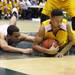 Huron's Mike Lewis(left) and Derrick Richardson fight over a loose ball as Ann Arbor Huron took on Ypsilanti  at Huron High School Friday December 16, 2011. Ypsilanti won the game 66-57. Jeff Sainlar I AnnArbor.com