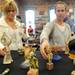 Perrysburg, Ohio residents Lita Campbell, left, and Candra Boggs look at figurines made by artist Diane Hawkey at the 30x30 show and fundraiser at the Ann Arbor Art Center. Angela J. Cesere | AnnArbor.com
