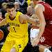 Michigan guard Stu Douglas tries to dribble around Indiana forward Kory Barnett. Angela J. Cesere | AnnArbor.com
