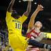Michigan guard Tim Hardaway Jr. makes a slam dunk while Indiana forward Derek Elston jumps to try and stop the basket. Angela J. Cesere | AnnArbor.com
