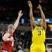 Michigan guard Trey Burke jumps up for a shot while Indiana forward Will Sheehey tries to block him. Angela J. Cesere | AnnArbor.com
