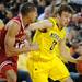 Michigan guard Zack Novak tries to dribble around Indiana guard Verdell Jones III. Angela J. Cesere | AnnArbor.com

